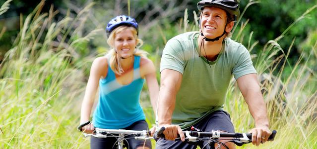 Man and woman cycling in nature